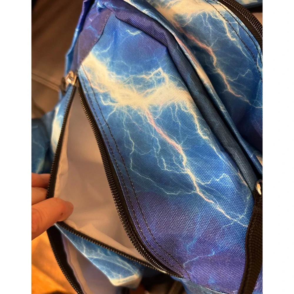 NWOT JanSport Back Pack, Blue Lightening. Multi Zip Pockets